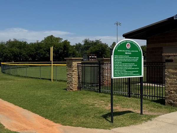 Buck Thomas Park softball field and Moore Parks sign